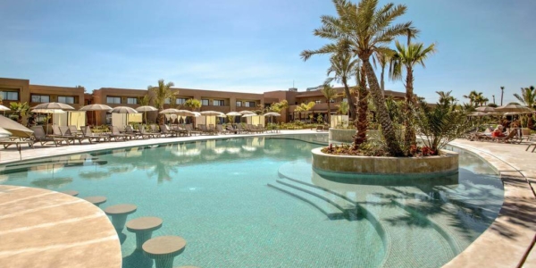 Be Live Collection Marrakech Adults Only overlooking the outdoor swimming pool surrounded by sun loungers and parasols