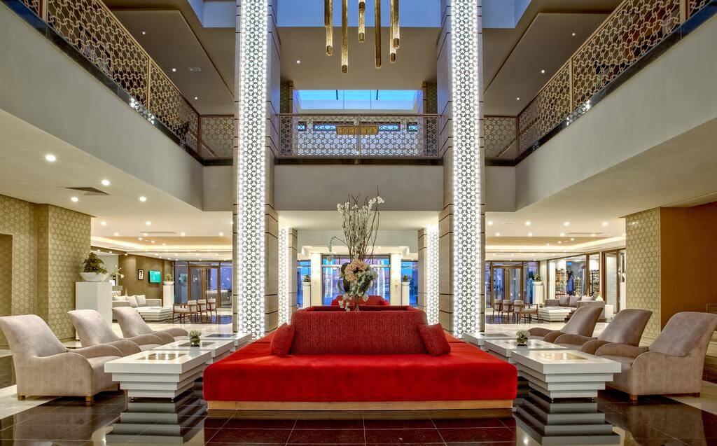 Be Live Collection Marrakech Adults Only lobby area with large square red sofa, grey seats and white tables