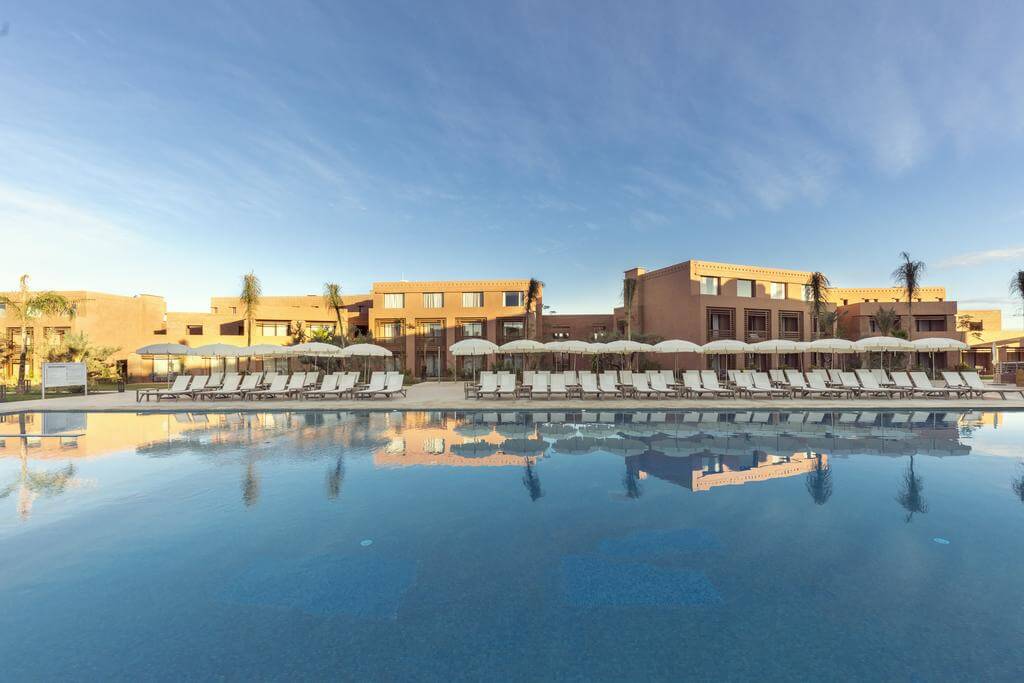 Be Live Experience Marrakech Palmeraie in the sunshine, overlooking the swimming pool and sun loungers