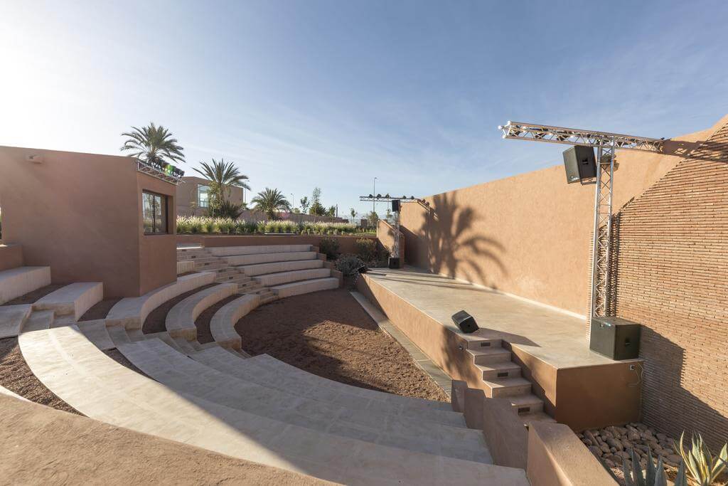 Outdoor amphitheatre at Be Live Experience Marrakech Palmeraie with speakers and lighting rig