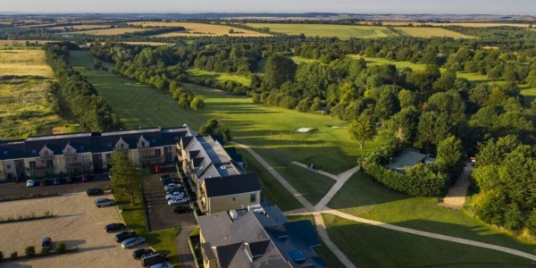 Ariel shot of Cotswolds Hotel Spa And Golf overlooking the course and car park