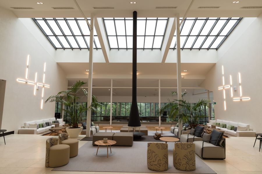 Lobby area at Hotel Encinar De Sotogrande with chairs and fire place