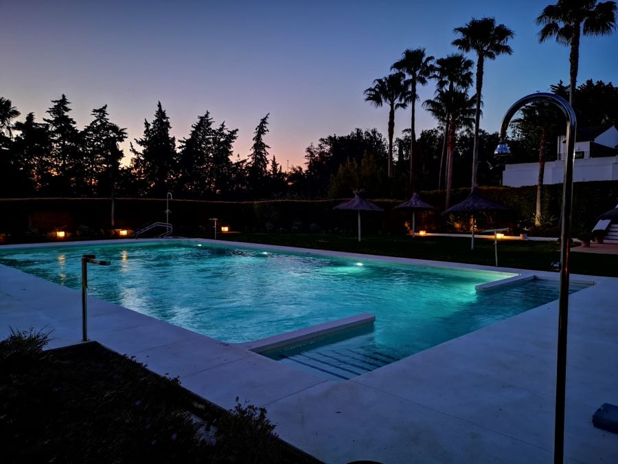 Swimming pool at night at Hotel Encinar De Sotogrande