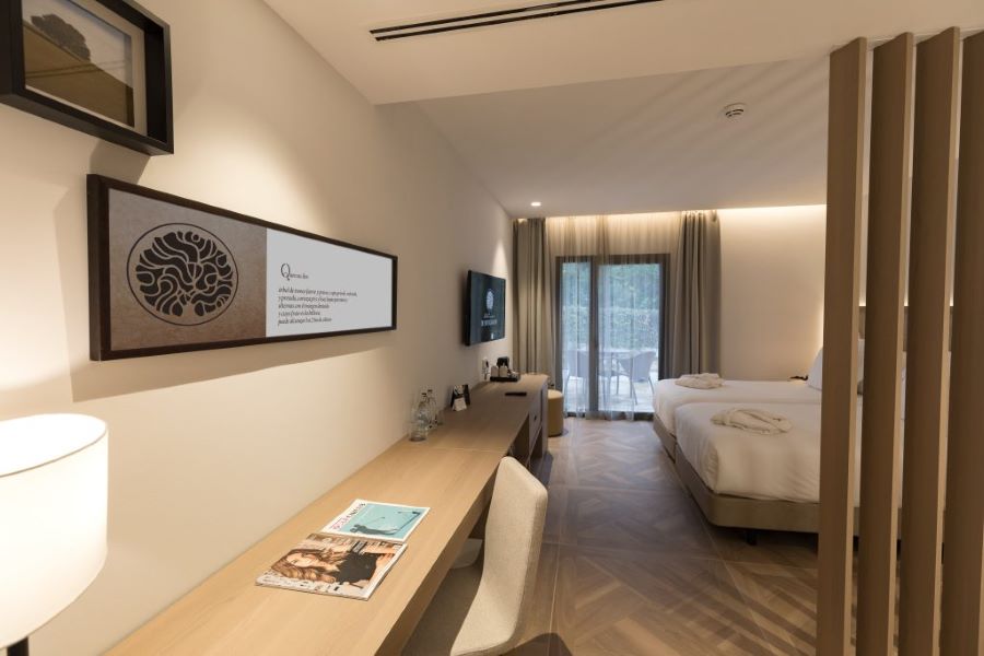 Television and desk in bedroom at Hotel Encinar De Sotogrande