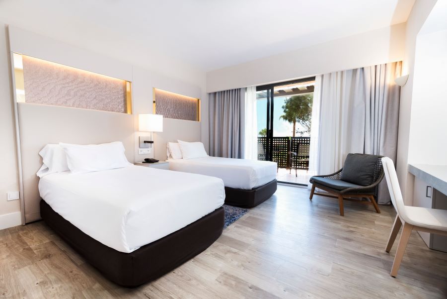 Bedroom with twin beds, desk and chair at DoubleTree by Hilton Islantilla Beach Golf Resort