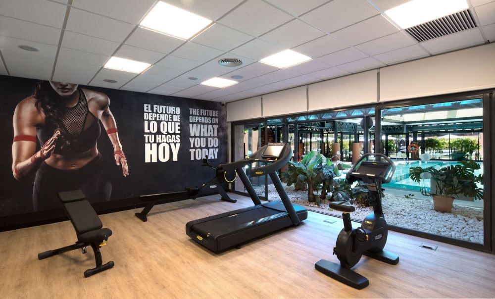 Gym with treadmill and bike at DoubleTree by Hilton Islantilla Beach Golf Resort