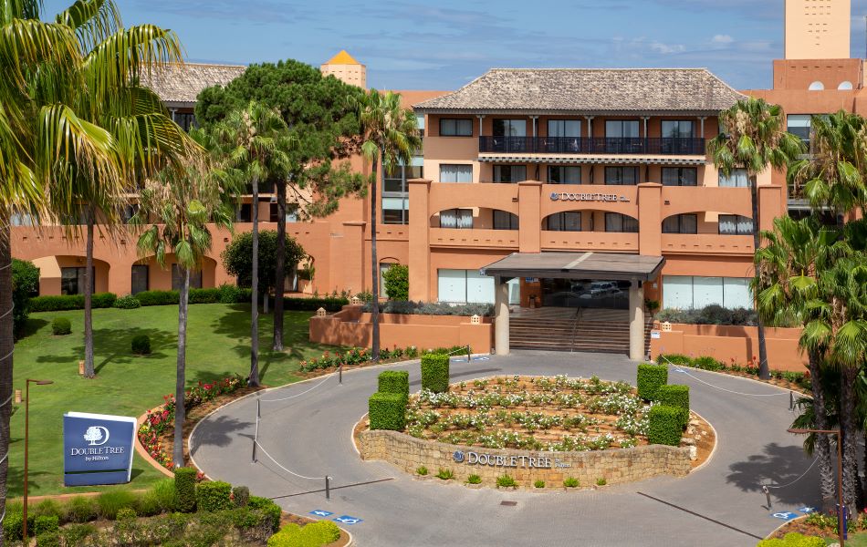 Exterior of DoubleTree by Hilton Islantilla Beach Golf Resort, featuring entrance