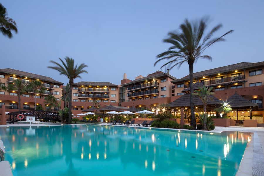 Swimming pool at night at DoubleTree by Hilton Islantilla Beach Golf Resort