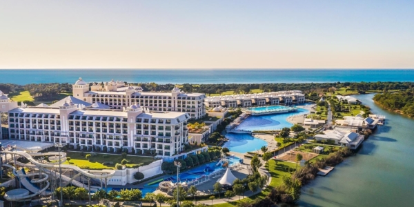 Ariel shot of Titanic Deluxe Golf Belek with the sea in the distance and the river running in parallel