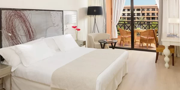 Double bedroom with private balcony at H10 Costa Adeje Palace