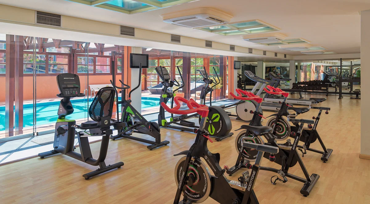 Gym with cardio equipment at H10 Costa Adeje Palace