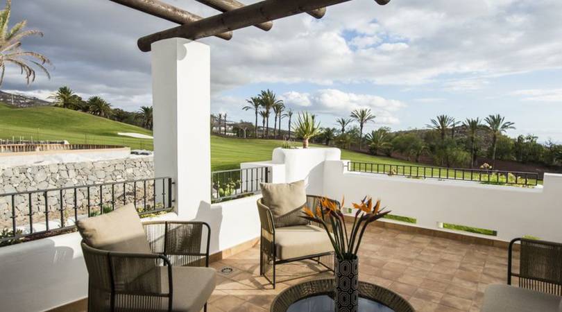 Patio at Las Terrazas de Abama Suites with outdoor furniture overlooking the golf course