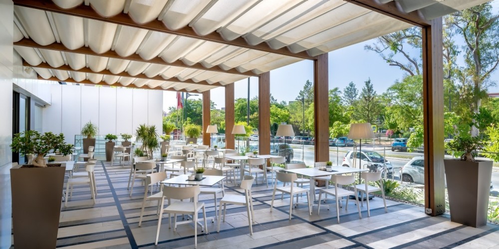 Outdoor bar area at Hotel Occidental Murcia Siete Coronas