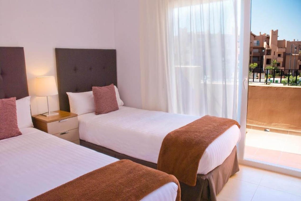 Twin beds in apartment at Ona The Residences at Mar Menor Golf Resort