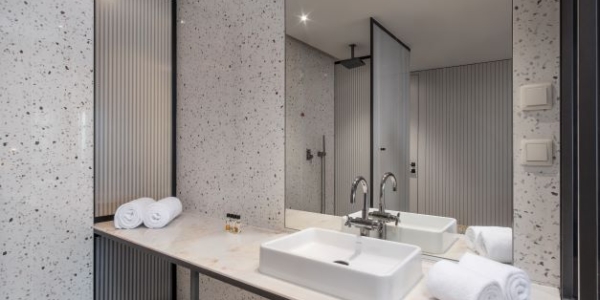 Bathroom at NEXT by Savoy Signature with separate shower cubicle, sink and mirror