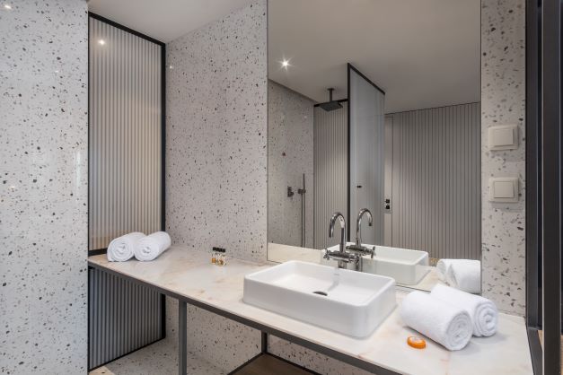 Bathroom at NEXT by Savoy Signature with separate shower cubicle, sink and mirror