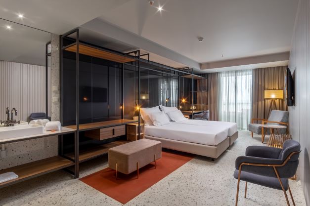Standard room with modern furnishings at NEXT by Savoy Signature in Funchal, Madeira