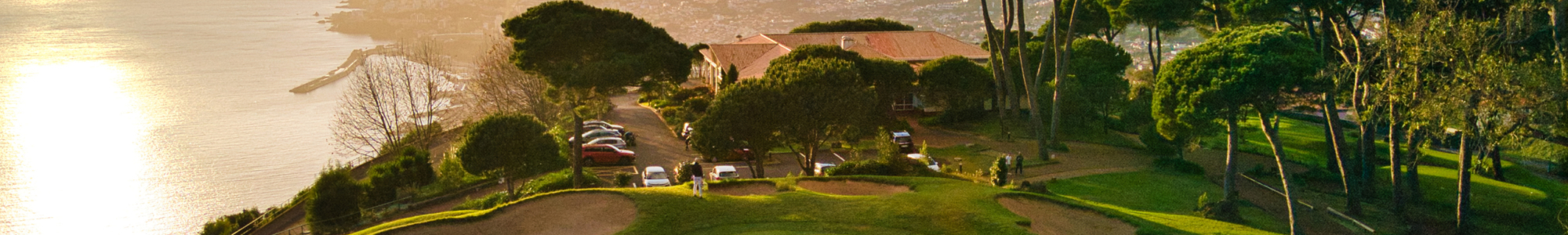 Photo of a Madeira golf course overlooking the sea at sunset
