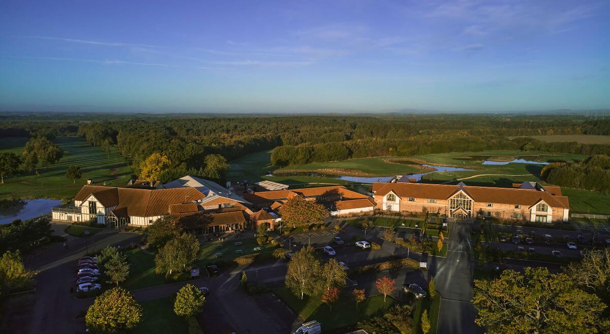 Arial view of Sandburn Hall near York, with golf course and forest surrounding the main hotel