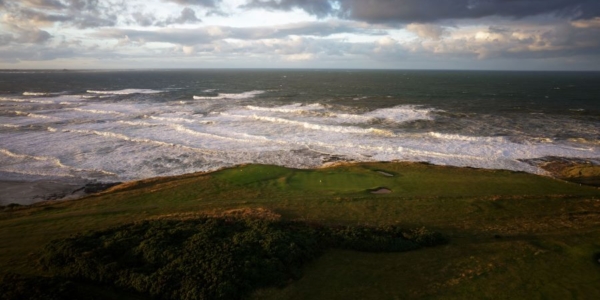 Holes 1 and 2 at Bamburgh Castle with the sea in the background