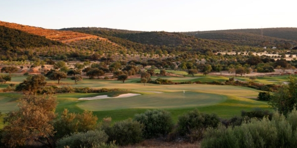 Ombria Golf Resort with trees in the background and the green protected by the bunker in the foreground