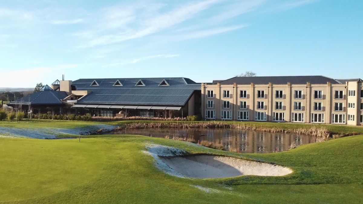 Exterior shot of Ramside Hall Hotel in Durham with a bunker in front of the green