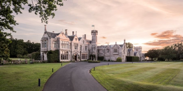 Exterior shot of Roxburghe Hotel & Golf Course with drive through grounds leading to entrance