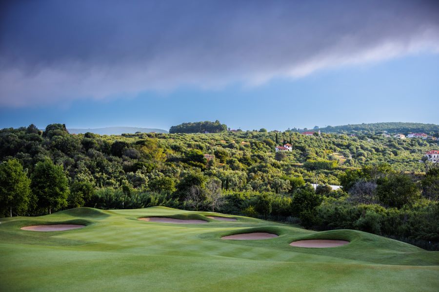 Sand filled bunkers with green trees in background at Costa Navarino in Greece