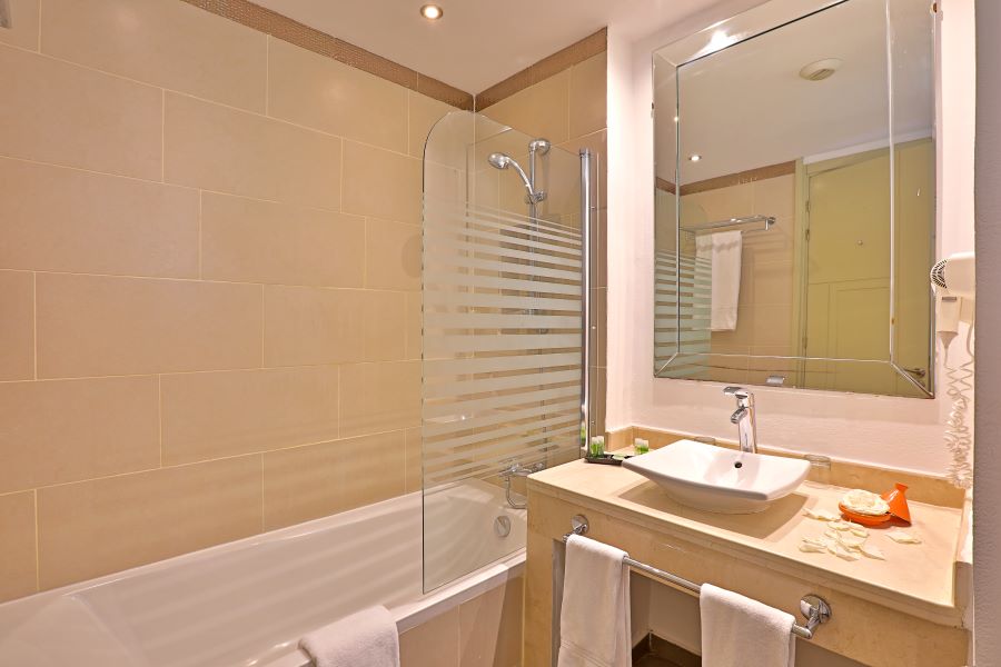 Shower and bath in bathroom at Kenzi Club Agdal Medina