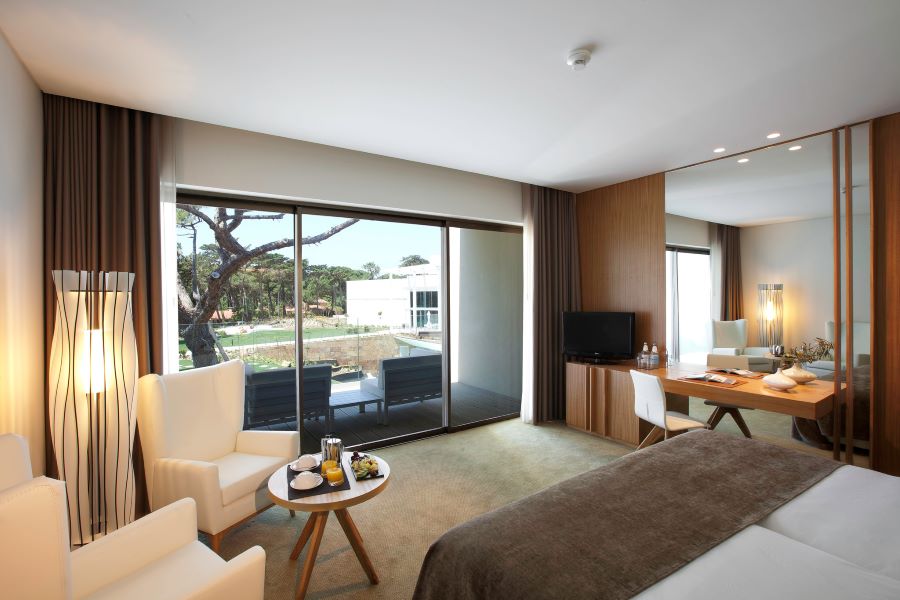 Bedroom with view out to golf course at Onyria Marinha Edition Hotel & Thalasso