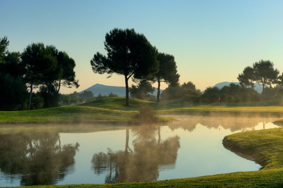 Mist over lake at Son Antem West Golf Course in Mallorca
