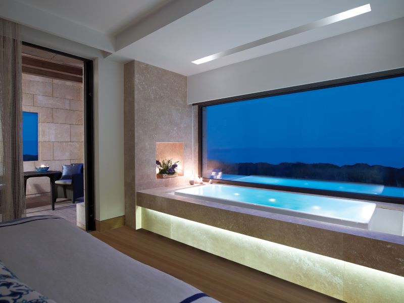 Bath tub with view outside at The Ramanos, A Luxury Collection Resort in Costa Navarino