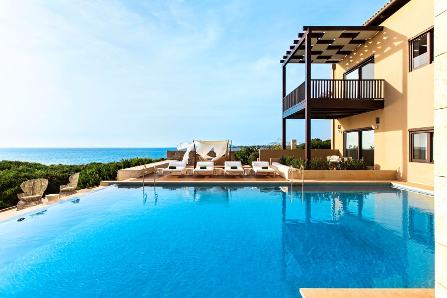 Resort swimming pool with balcony overhanging at The Ramanos, A Luxury Collection Resort in Costa Navarino