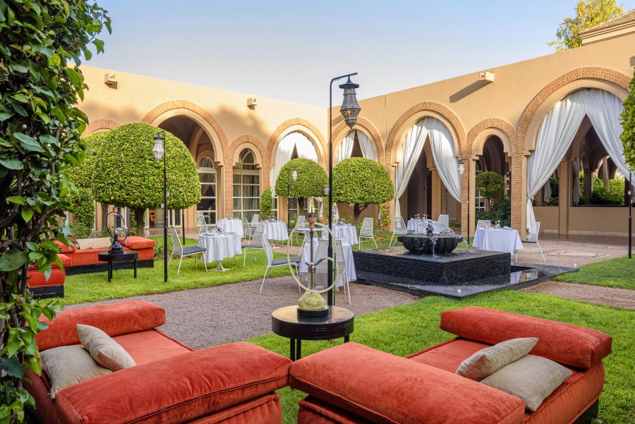 Outdoor seating area in gardens at Barcelo Palmeraie resort