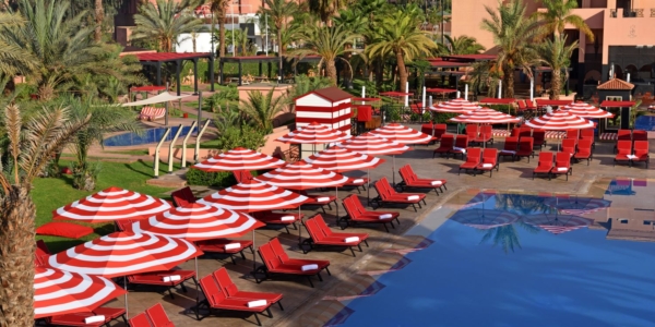 Swimming pool with sun loungers at Movenpick Hotel Mansour Eddahbi Marrakech