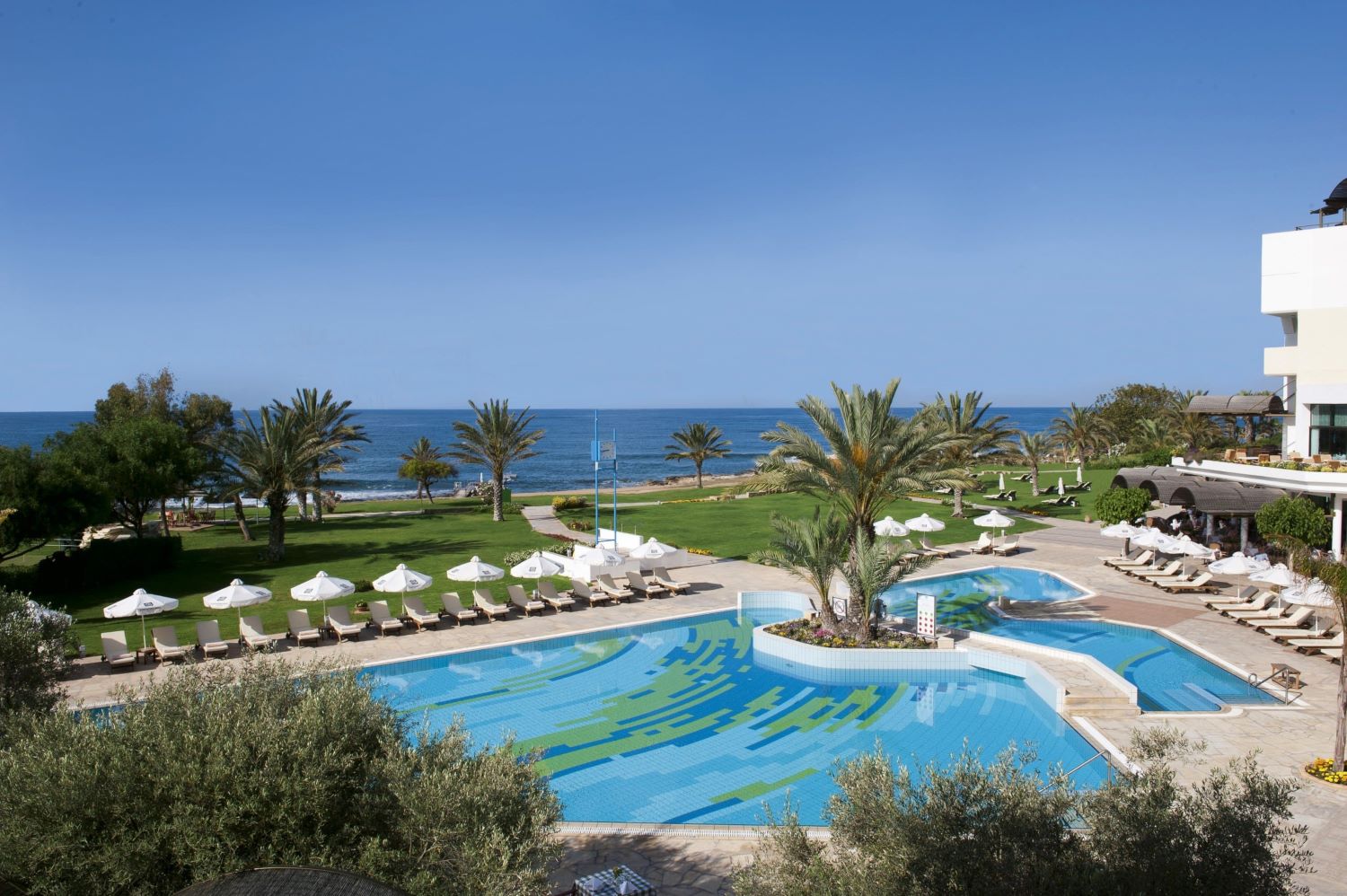 Outdoor swimming pool at Constantinou Bros Athena Royal Beach Hotel
