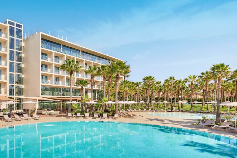Blue sky overlooking Algarve Marriott Residences Salgados Resort Conference Centre with the large adult swimming pool in front