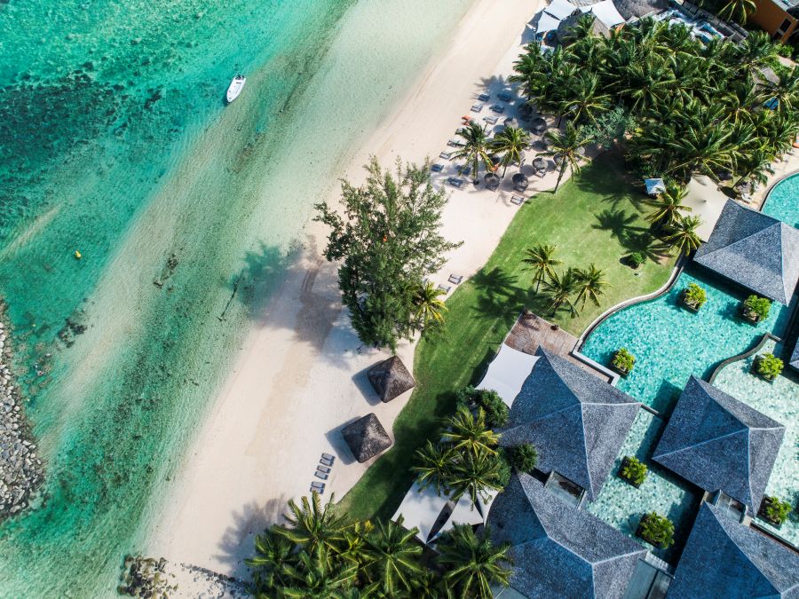 Beach and sea against the resort at Heritage Awali Golf & Spa Resort
