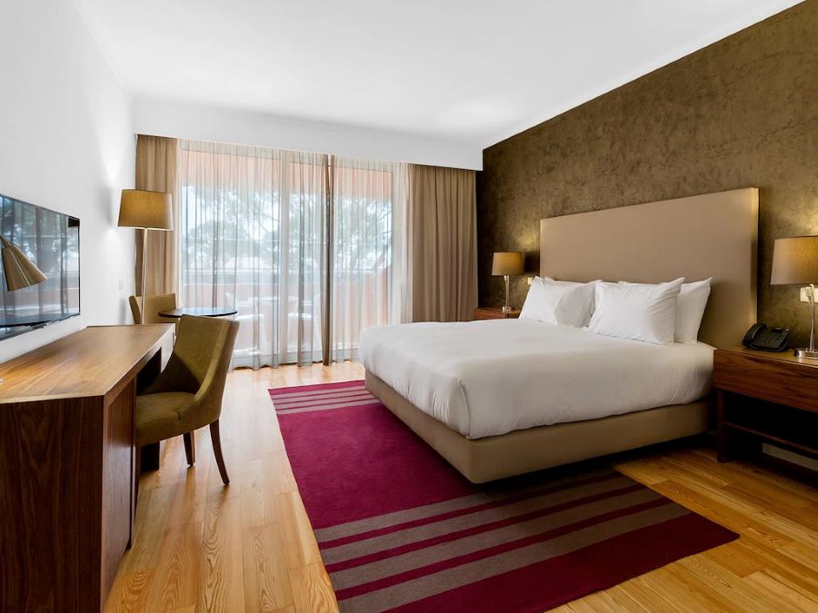 Double bed with balcony view at Vilamoura Garden Hotel in the Algarve