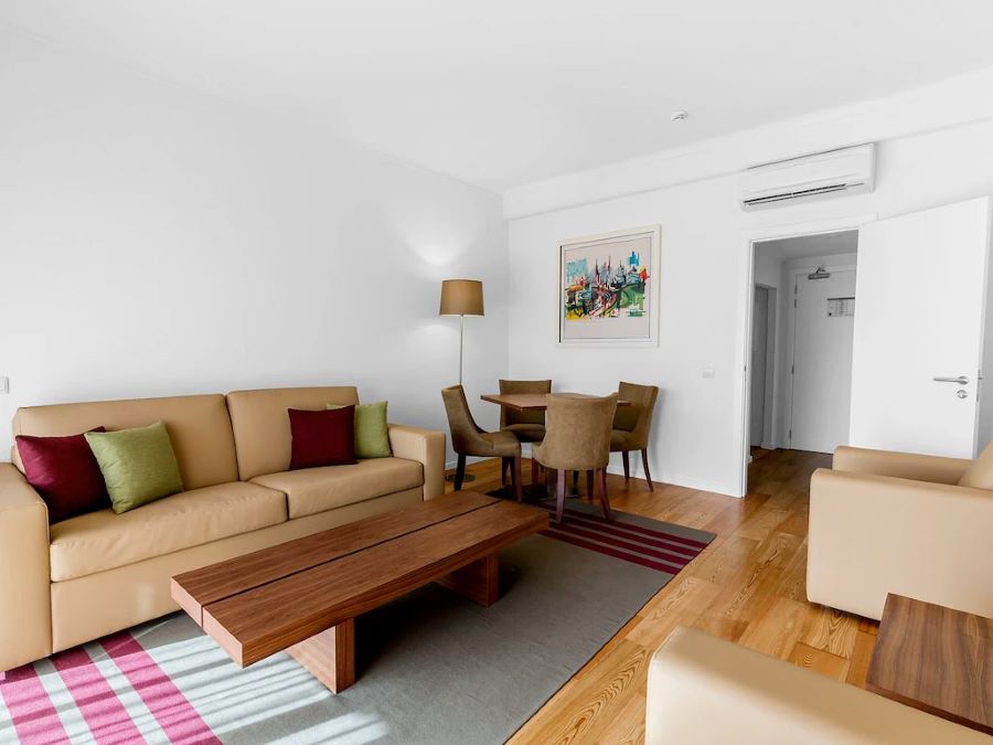 Living area with sofa and coffee table in accommodation at Vilamoura Garden Hotel