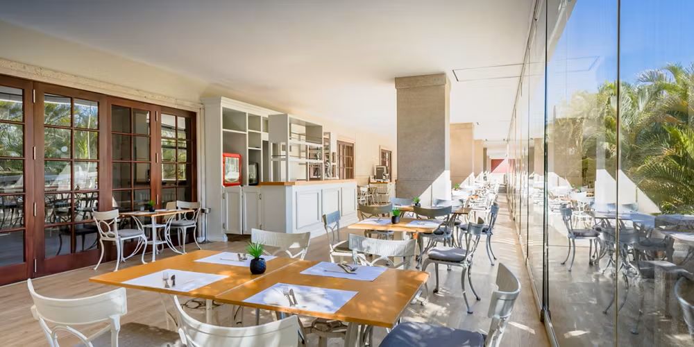 Restaurant with tables set for guests at Barcelo Marbella Hotel