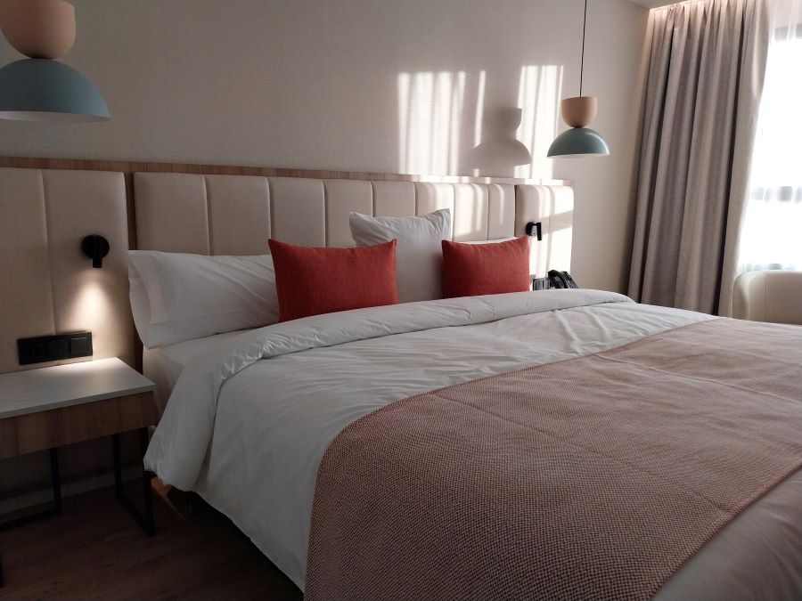 Red cushions on the bed at Obal Urban Hotel in Costa Del Sol