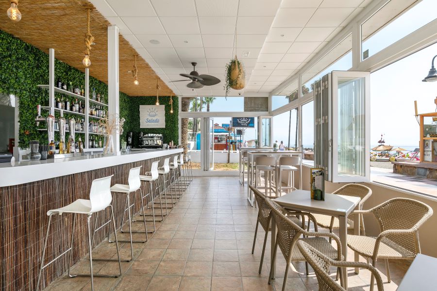 Bar stools and tables in the bar at Sol Puerto Marina
