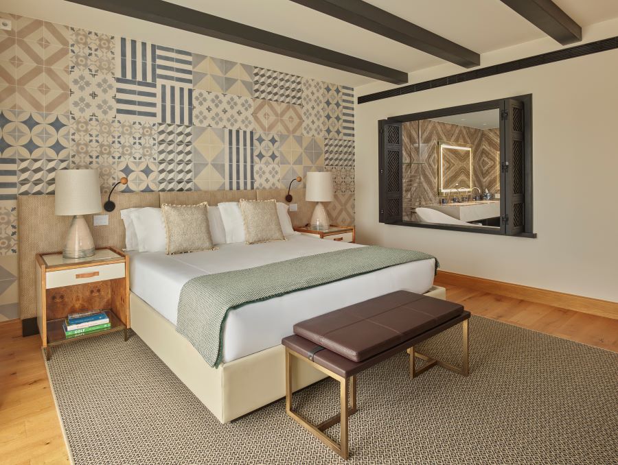 Bedroom with stool at end of the bed at Viceroy at Ombria Algarve