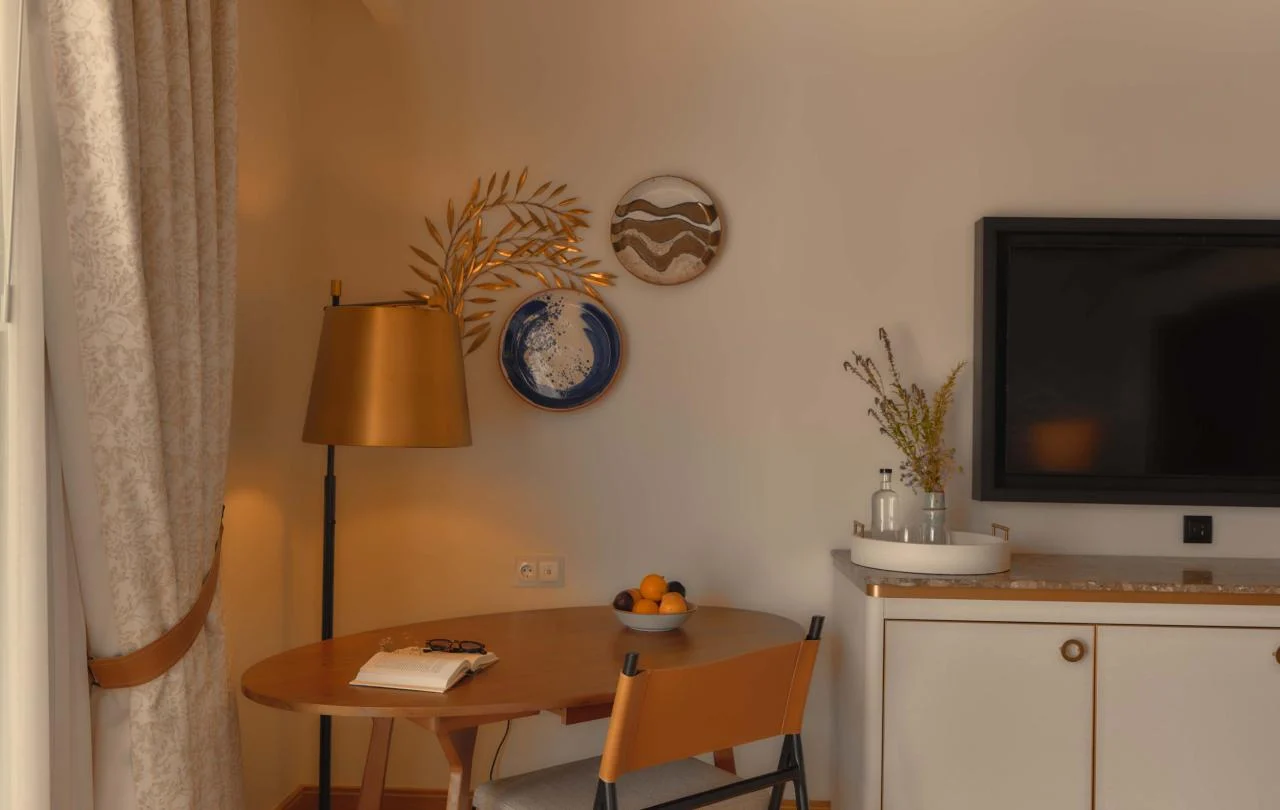 Table and chairs in the corner of room at Viceroy at Ombria Algarve