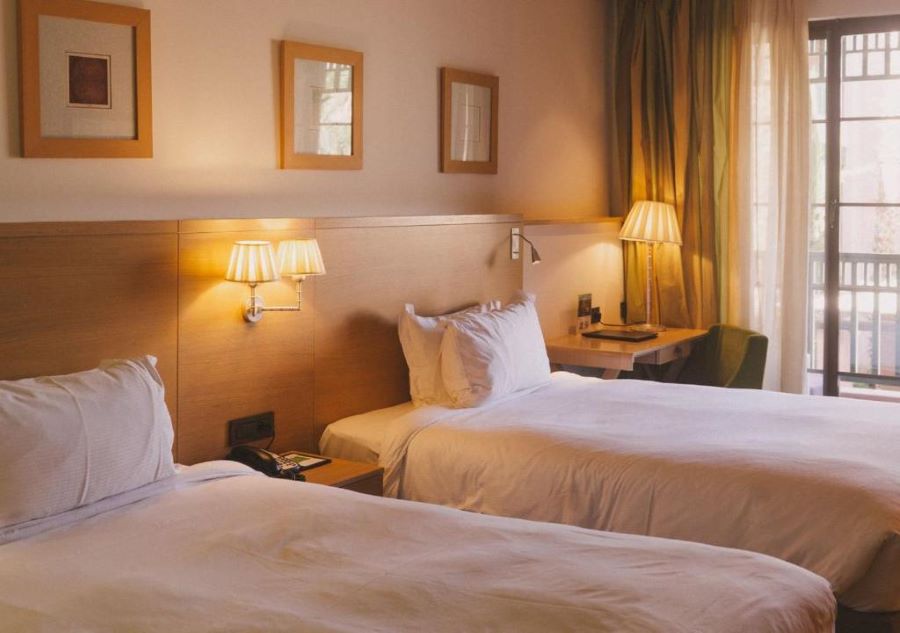 Twin bed in bedroom at Pickalbatros Hotel Du Golf Palmeraie Marrakech