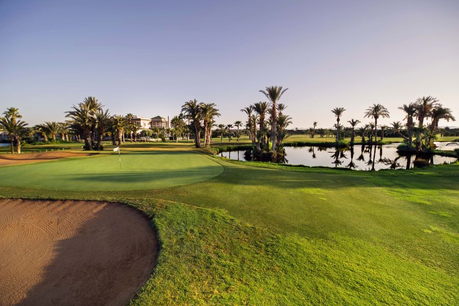 Lake to the right and bunker to the left at Golf Club Palmeraie Marrakech