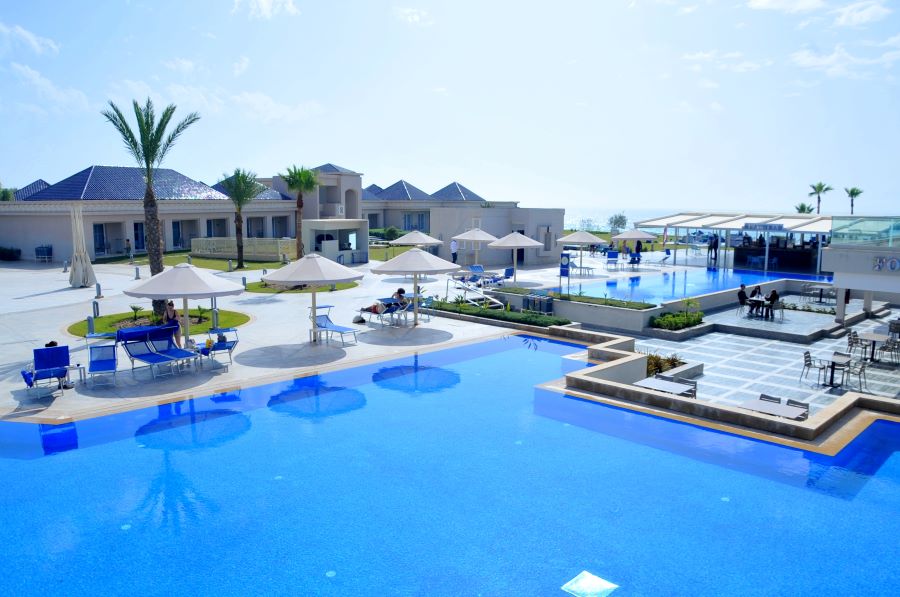 Large outdoor swimming pool and sun loungers at Pickalbratros White Beach Taghazout Resort