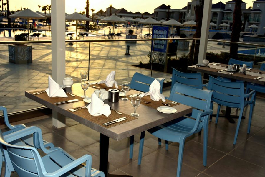 Restaurant with blue chairs at Pickalbratros White Beach Taghazout Resort