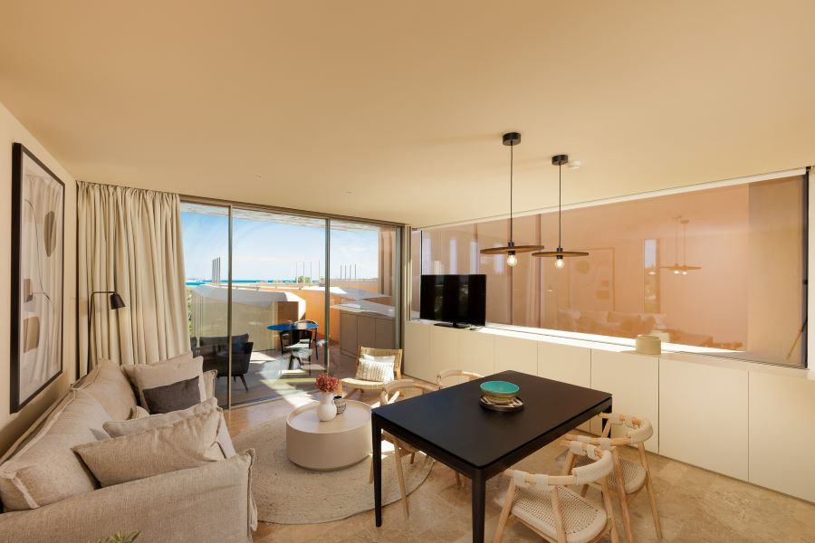 Living area with view over golf course at Palmares Signature Apartments